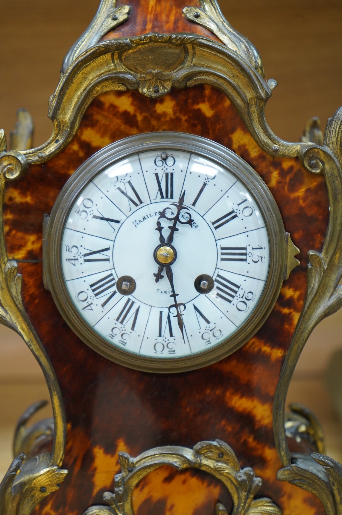 A Louis XV style tortoiseshell and ormolu-mounted mantel clock with pendulum and key, the dial inscribed Hamilton & Inches, Paris, 41cm high